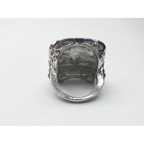 150 - An Art Deco, silver (stamped 925) ring, of large proportions, with blue and white sapphires. Present... 