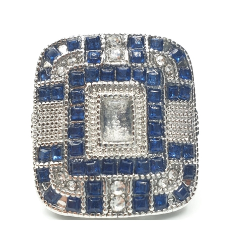 150 - An Art Deco, silver (stamped 925) ring, of large proportions, with blue and white sapphires. Present... 