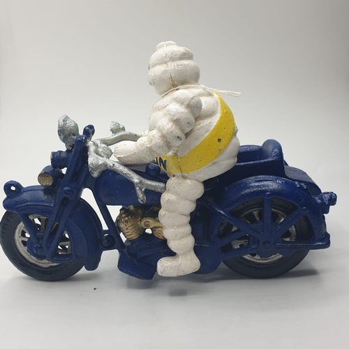 59 - A rare and real collector’s item, French, cast iron MICHELIN MAN and his son on a combination
motorb... 