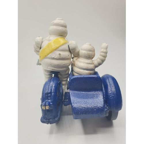 59 - A rare and real collector’s item, French, cast iron MICHELIN MAN and his son on a combination
motorb... 