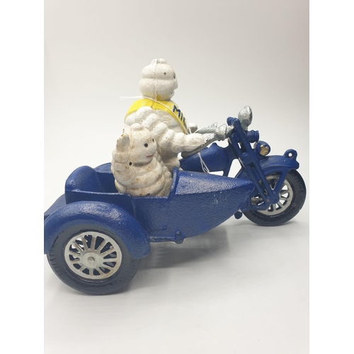 59 - A rare and real collector’s item, French, cast iron MICHELIN MAN and his son on a combination
motorb... 