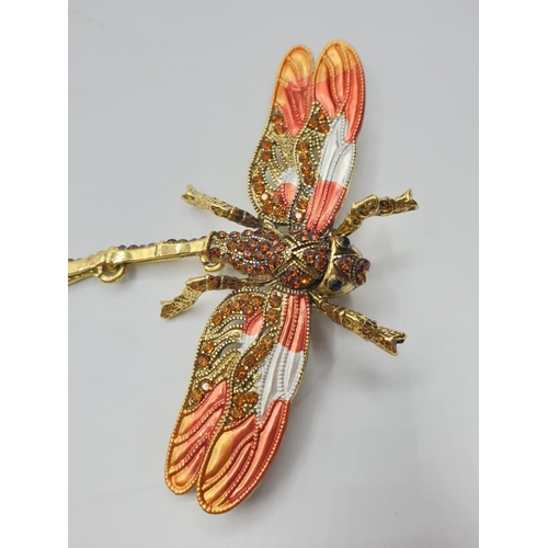 92 - Three large dragonfly brooches in a wooden box. Enamel applied by hand on various metals with imitat... 