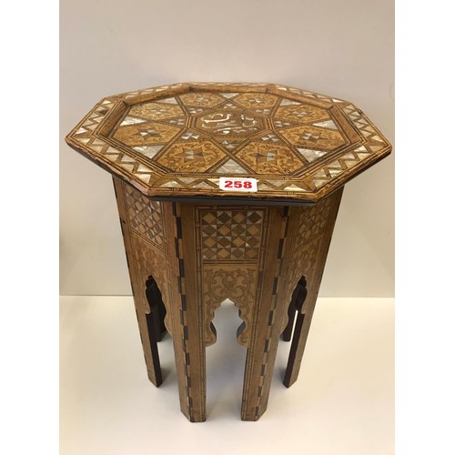 258 - An octagonal Moroccan inlaid M.O.P side table, H53.5cm x W40cm