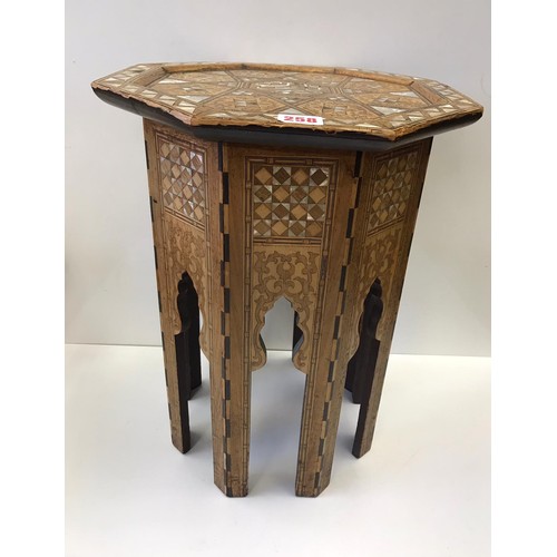 258 - An octagonal Moroccan inlaid M.O.P side table, H53.5cm x W40cm