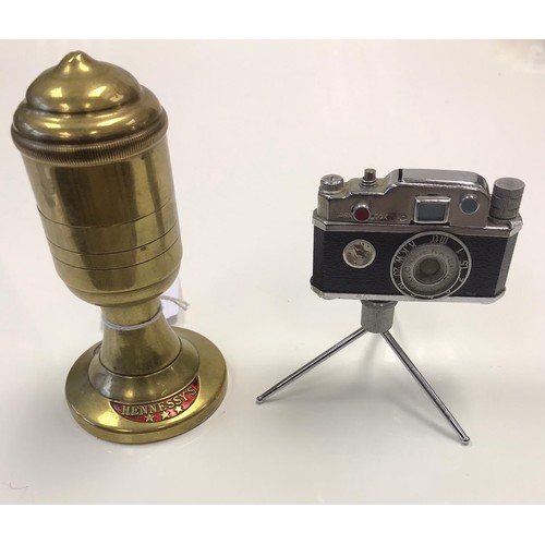 177 - 2x Novelty lighters, Hennesy's monopole champagne and a camera on tripod (2)