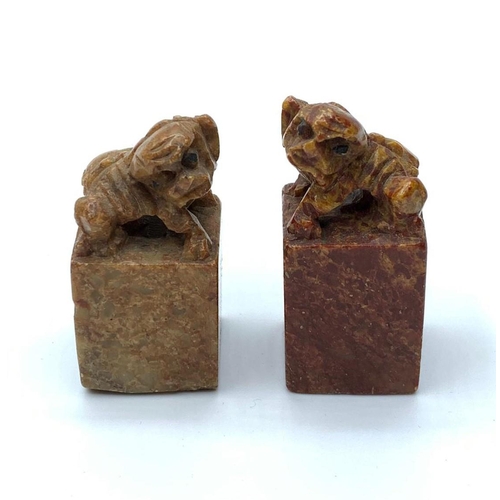 530 - An antique, near pair, Chinese, hand carved, seal stones of fu dogs. Height: 4.5 & 5cm.