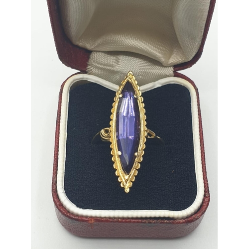 541 - 18ct Gold Boat Shape Ring with Tanzanite Centre Stone, 4.7g, Size L.