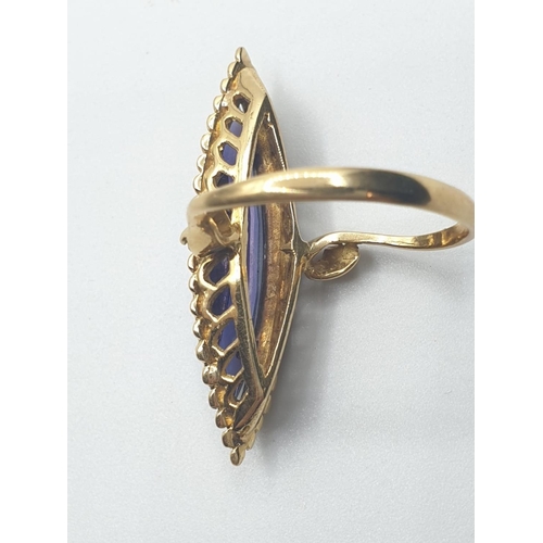 541 - 18ct Gold Boat Shape Ring with Tanzanite Centre Stone, 4.7g, Size L.