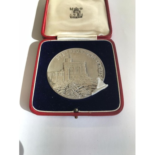 521 - A cased George and Mary Jubilee medal in fine condition.