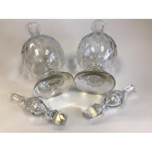 524 - A pair of Georgian hand blown decanters with their original stoppers. One stopper insert is damaged ... 