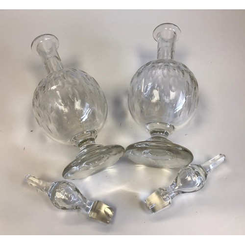 524 - A pair of Georgian hand blown decanters with their original stoppers. One stopper insert is damaged ... 