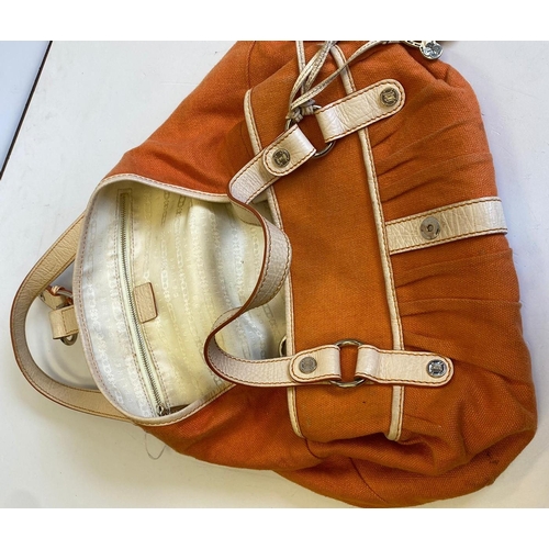 159 - An canvas orange and cream coloured leather Celine handbag, 38cmx23cm