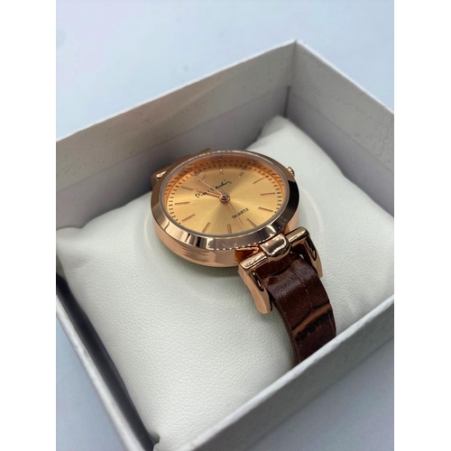 259 - Ladies Pierre Cardin wristwatch.  rose gold colour having brown 'crocodile' strap and quartz movemen... 