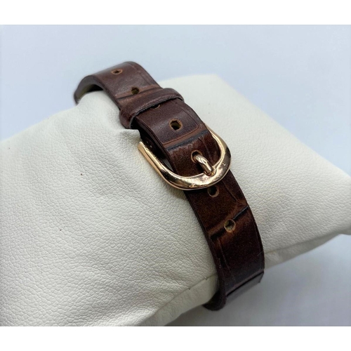 259 - Ladies Pierre Cardin wristwatch.  rose gold colour having brown 'crocodile' strap and quartz movemen... 