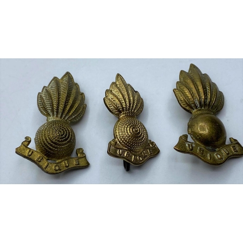 391 - Royal Artillery brass UBIQUE with a pair of collar badges matching