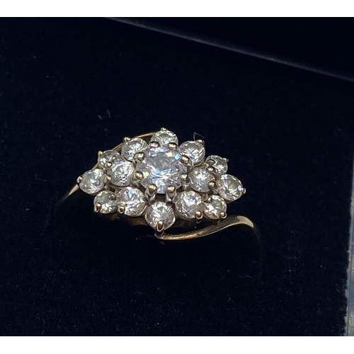 441 - 9ct gold gemstone cluster RING having sparkling stones in large flora formation to top.  Full UK 9ct... 