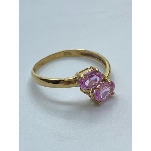 85 - 9ct gold pink topaz and diamond RING.
having twin faceted oval pink topaz to mount with two small di... 