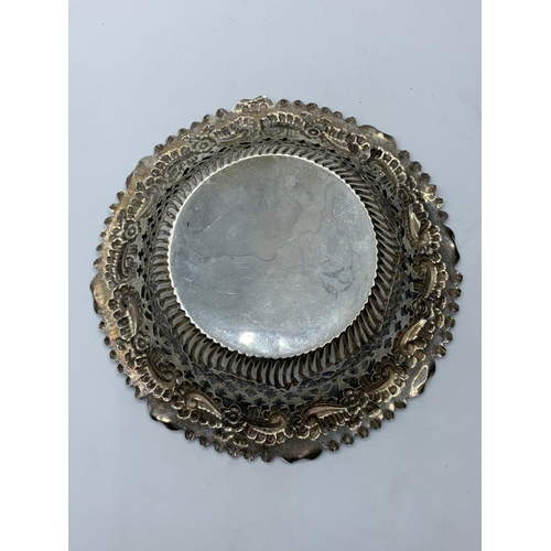 182 - Antique silver bon bon dishes, having scroll repousse work to rim and pierced silver pattern to side... 