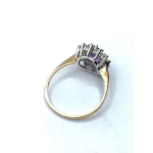 204 - 9ct gold ring having a large oval faceted amethyst to mount with a full zirconia surround. Clear hal... 