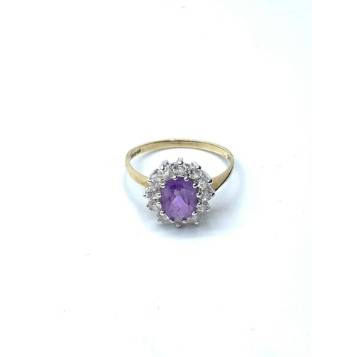 204 - 9ct gold ring having a large oval faceted amethyst to mount with a full zirconia surround. Clear hal... 