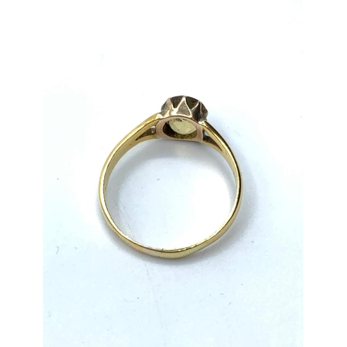 285 - 18ct gold ring having faceted oval citrine to top, pierced shoulder gold work, 2g weight and size K