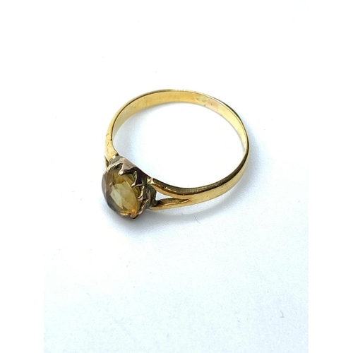 285 - 18ct gold ring having faceted oval citrine to top, pierced shoulder gold work, 2g weight and size K