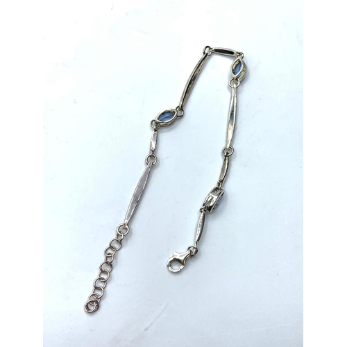 288 - Silver and blue tourmaline bracelet. 18cm in length but extends to 20cm approx. Marked 925 silver, b... 