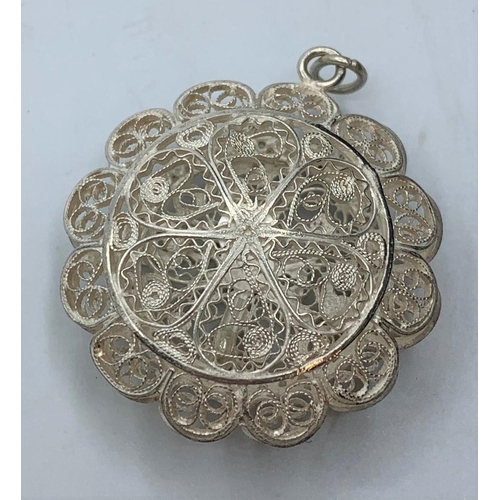 345 - Vintage silver filigree locket in circular cage form, having hinged opening to front with the word R... 