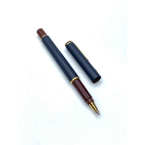 346 - Parker ball pen in navy blue and burgundy with gold colour trim, complete with matching Swede fabric... 