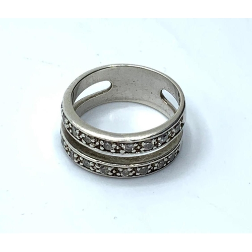 389 - Silver double band ring having clear stones in half hoop fashion to both bands, marking clearly show... 