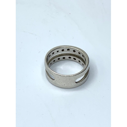 389 - Silver double band ring having clear stones in half hoop fashion to both bands, marking clearly show... 