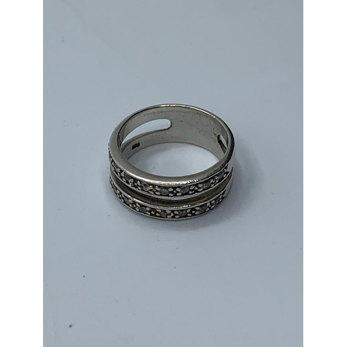 389 - Silver double band ring having clear stones in half hoop fashion to both bands, marking clearly show... 