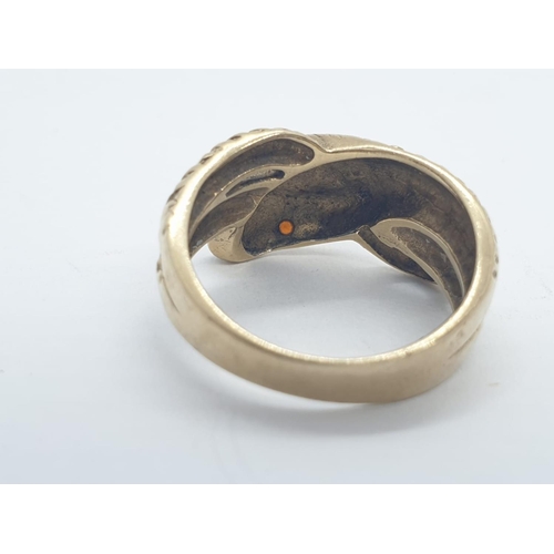 102 - 9CT Y/G SNAKE RING WITH RED STONE EYES, WEIGHT 4.6G AND SIZE M1/2