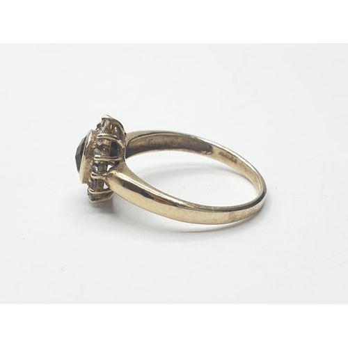 156 - 9ct gold RING having faceted natural topaz mounted to top.  Zirconia surround.  Full UK Hallmark for... 