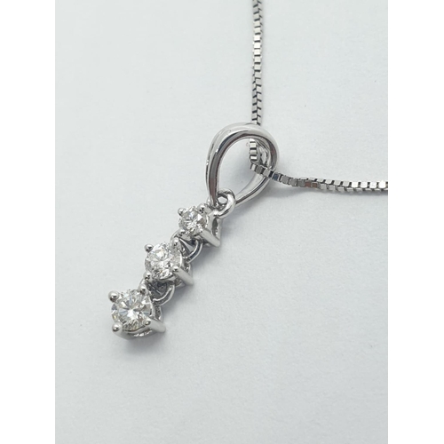 164 - 18CT W/G  3 STONE DIAMOND PENDANT ON CHAIN 0.14CT, WEIGHT 1.5G AND 45CM LONG APPROX