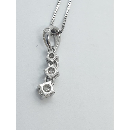 164 - 18CT W/G  3 STONE DIAMOND PENDANT ON CHAIN 0.14CT, WEIGHT 1.5G AND 45CM LONG APPROX