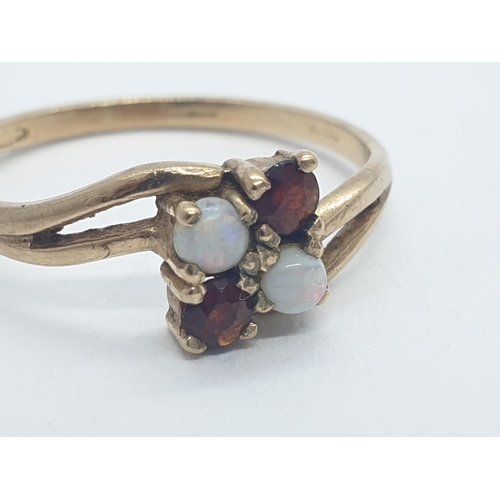 187 - 9CT Y/G GARNET AND OPAL 4 STONE RING, WEIGHT 1.4G AND SIZE L1/2