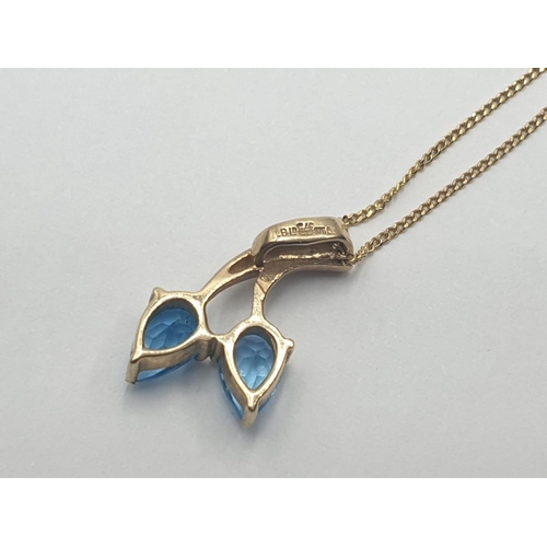 206 - 9CT Y/G BLUE TOPAZ SET PENDANT ON CHAIN, WEIGHT 1.8G AND 47CM LONG APPROX