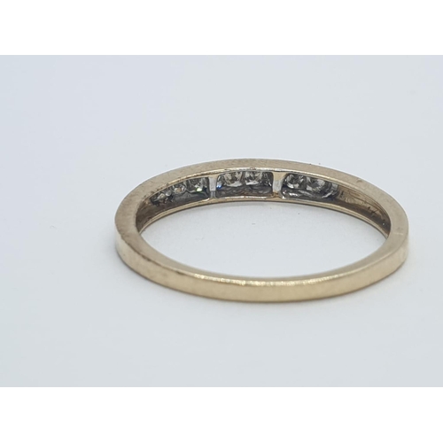 208 - 9CT Y/G DIAMOND CHANNEL SET HALF ETERNITY RING , WEIGHT 1.5G AND 0.25CT APPROX SIZE N1/2