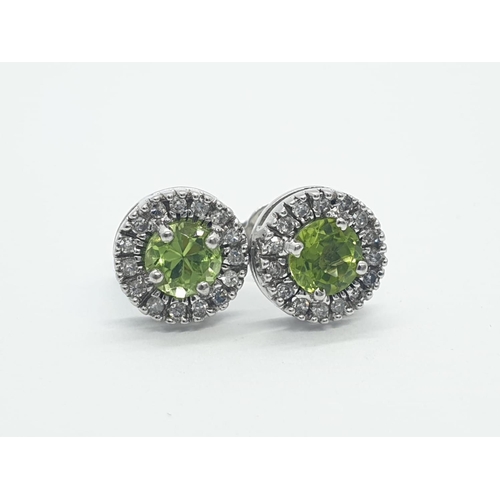 216 - 9CT W/G DIAMOND AND PERIDOT STUD CLUSTER EARRINGS, WEIGHT 2.6G