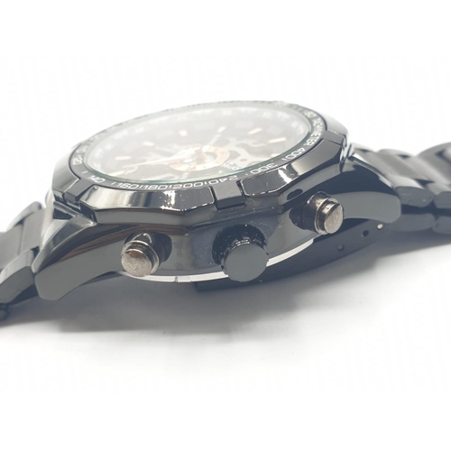 231 - Chronograph skeleton watch by ESS. Fully automatic with black and metal strap and bezel. Original bo... 