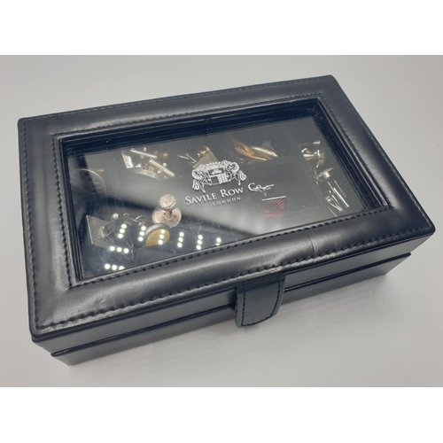 244 - Gentleman's leather jewellery box having clear lid and showing Savile Row Company London.  Filled wi... 