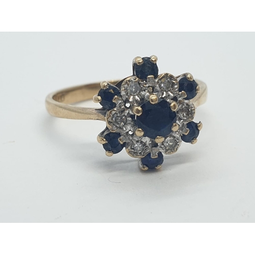 256 - 9CT Y/G DIAMOND AND SAPPHIRE CLUSTER RING, WEIGHT 2.2G AND SIZE N1/2