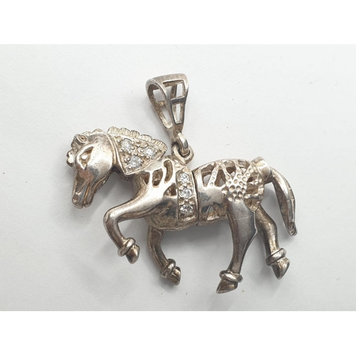 532 - Silver horse pendant having articulated head and tail and part decorated with zirconias. Full UK hal... 