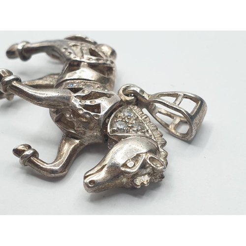 532 - Silver horse pendant having articulated head and tail and part decorated with zirconias. Full UK hal... 