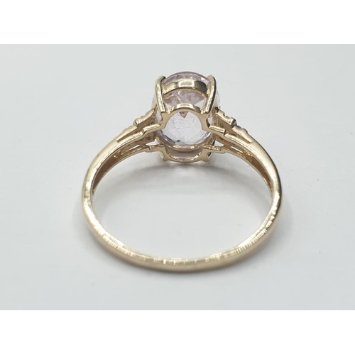 58 - 9ct gold RING having a large faceted oval morganite solitaire.  1.5ct to top.  Diamonds to shoulders... 