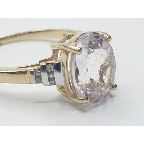 58 - 9ct gold RING having a large faceted oval morganite solitaire.  1.5ct to top.  Diamonds to shoulders... 