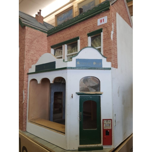 91 - Dolls house 62cm high, 60cm wide and 29cm deep with opening front and rood plus a large amount of do... 