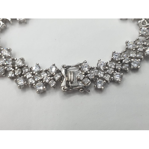 297 - Silver bracelet stone set with zirconias. Full UK hallmark for Birmingham silver DQCZ 925 7.25 inche... 