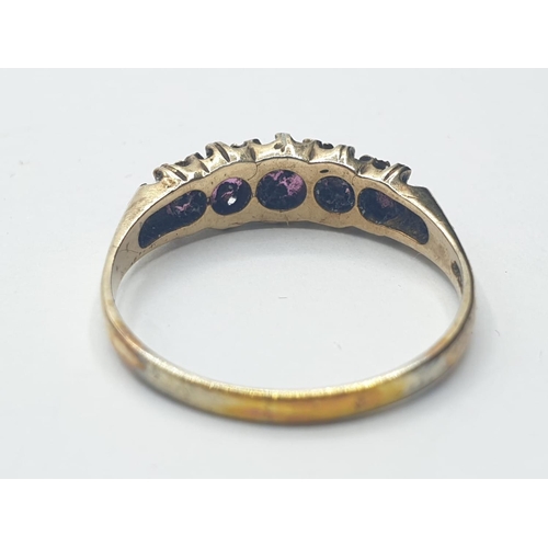 302 - 9ct gold ring having five natural spinel stones in Gypsy fashion. Size P